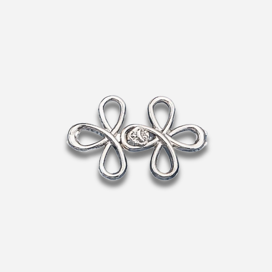Silver sculpted waist knot on a light gray background