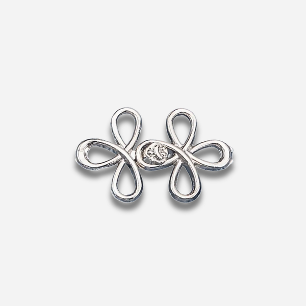 Silver sculpted waist knot on a light gray background