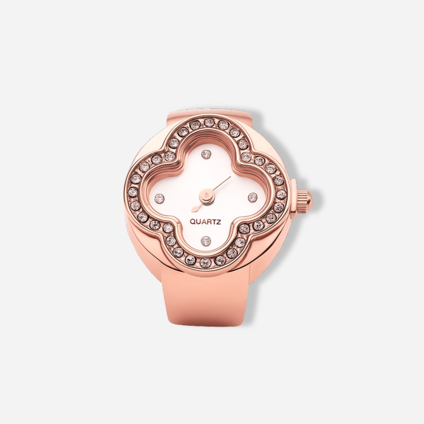 Rose gold ring watch with gemstone accents on a light gray background
