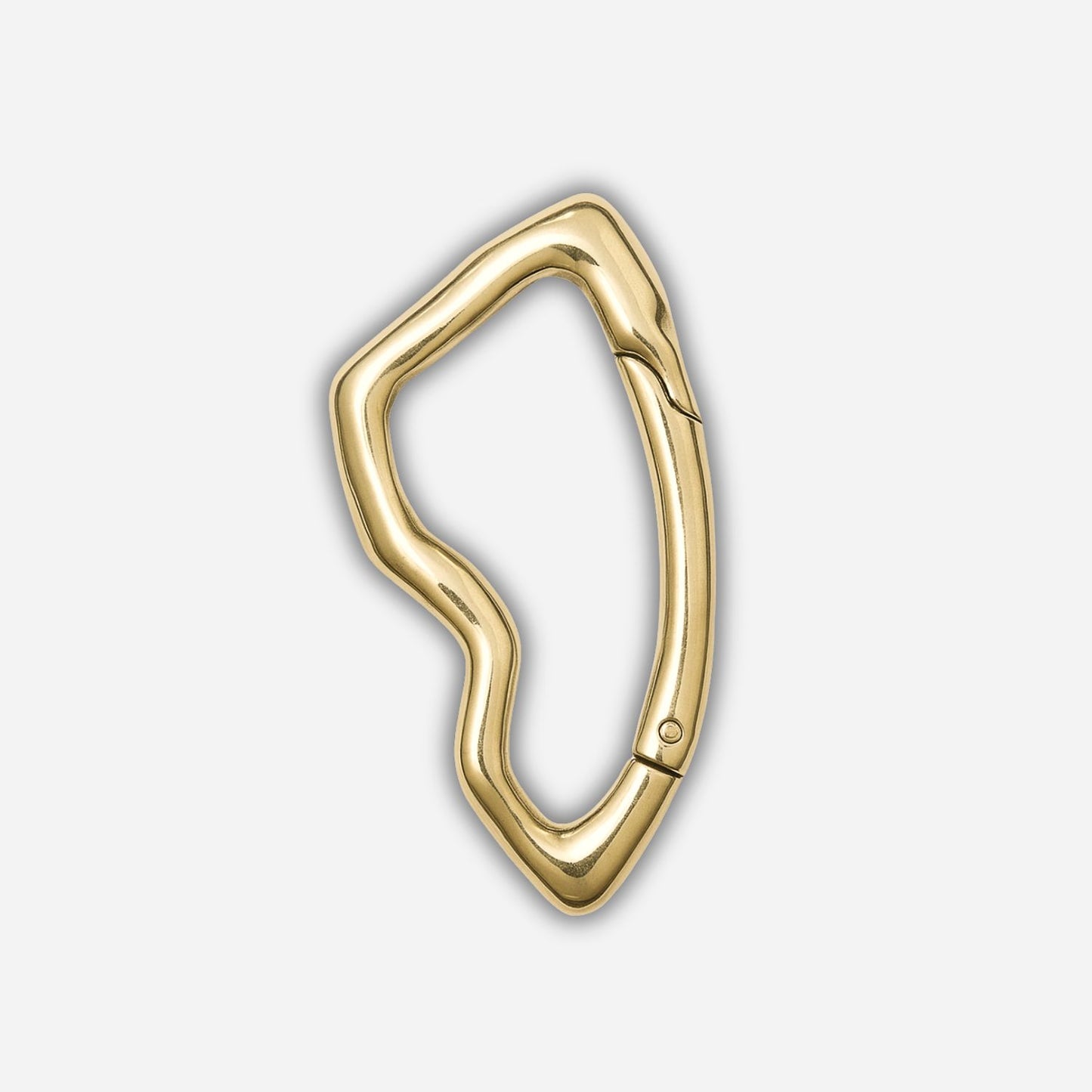 Gold carabiner on a light gray background