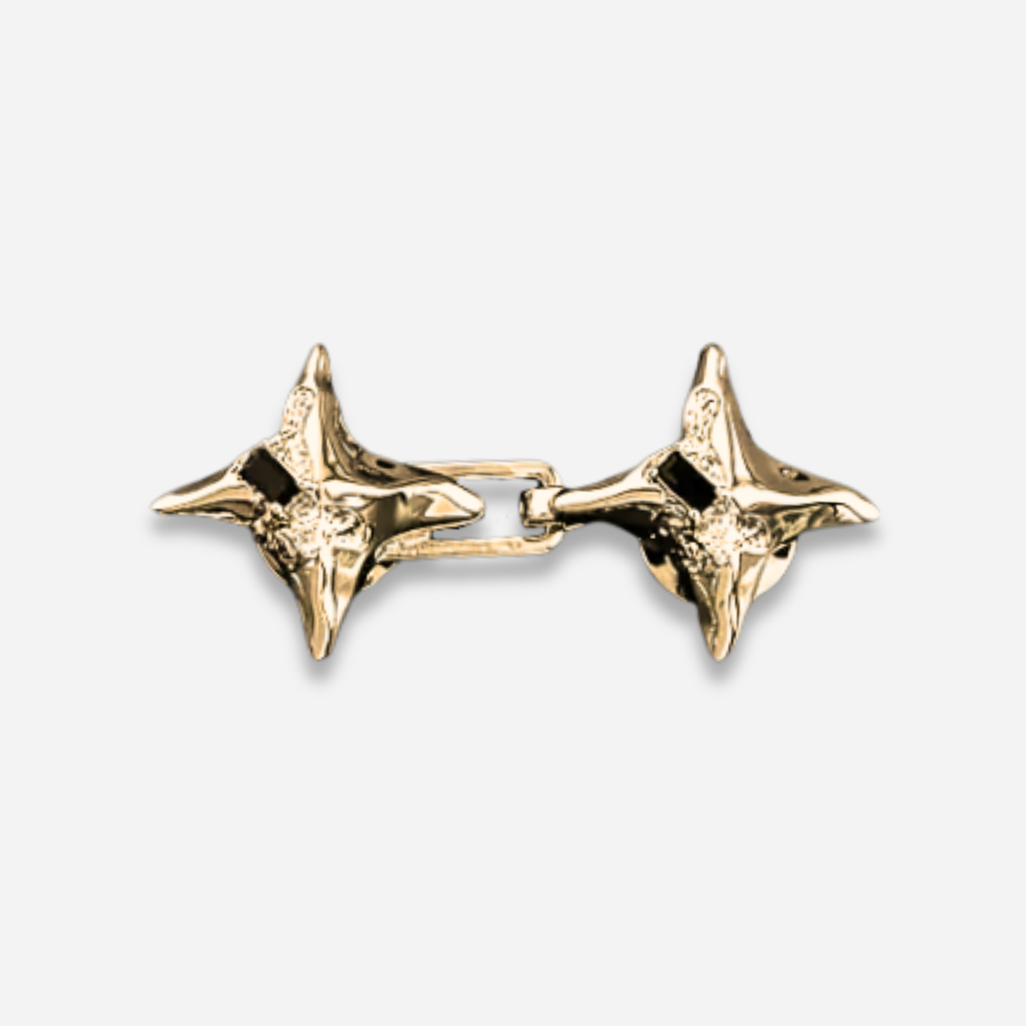 Pair of gold Waist Knots on a light gray background