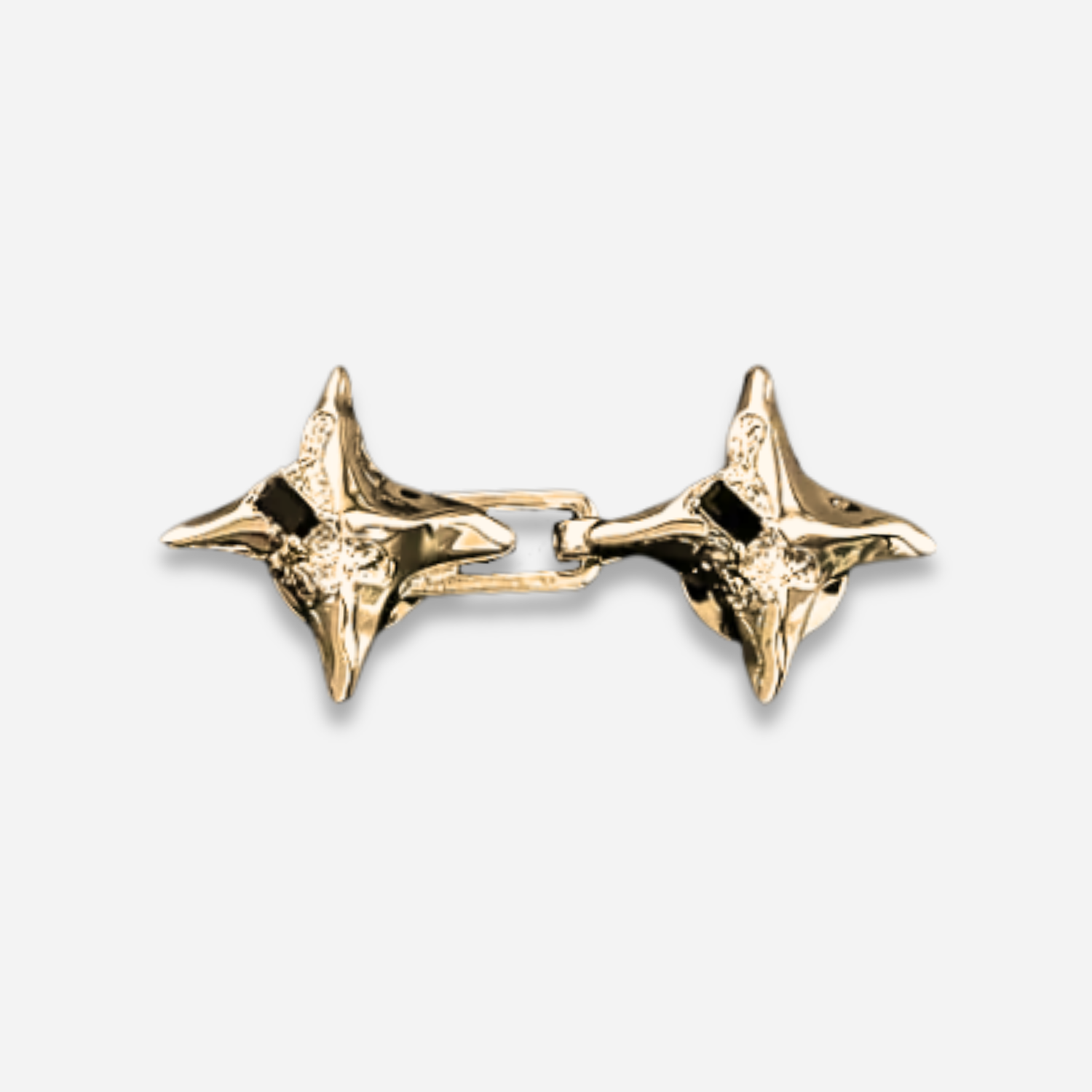 Pair of gold Waist Knots on a light gray background