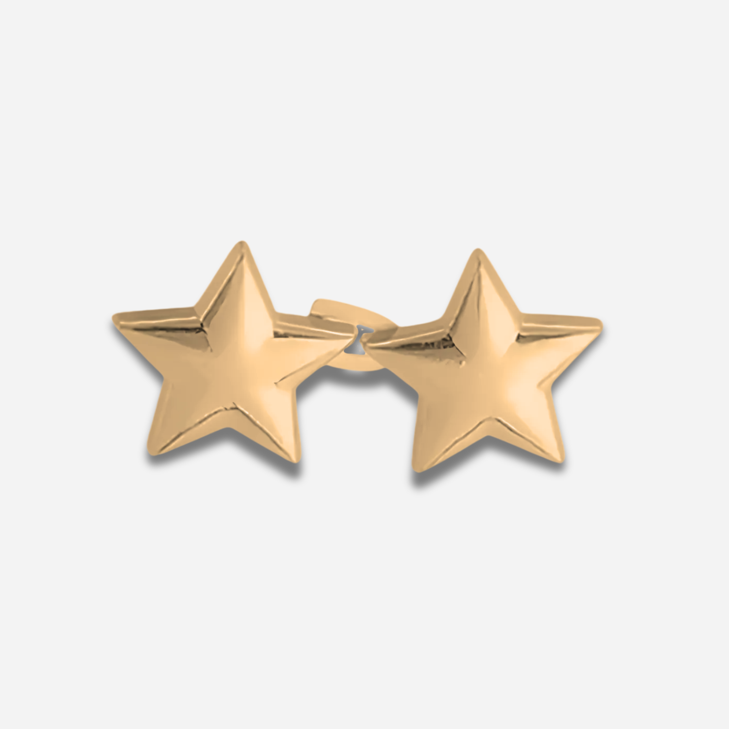 Pair of gold star waist knots on a white background