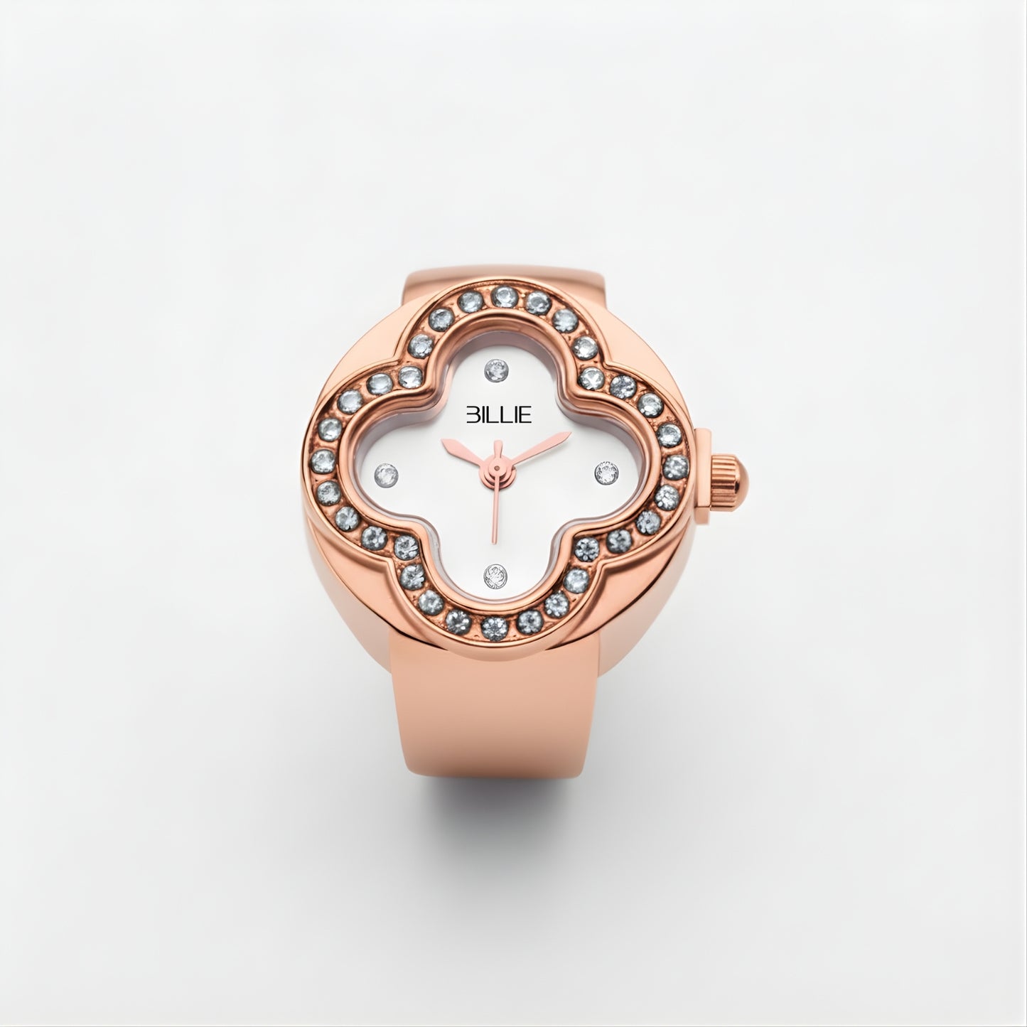Rose gold watch with gemstone accents on a light gray background