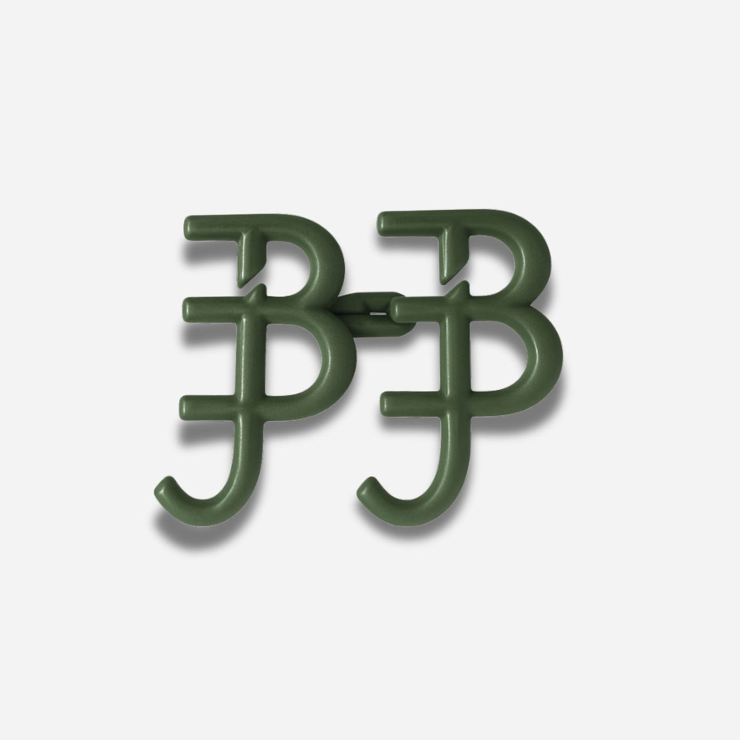 Pair of green signature waist knots on a white background