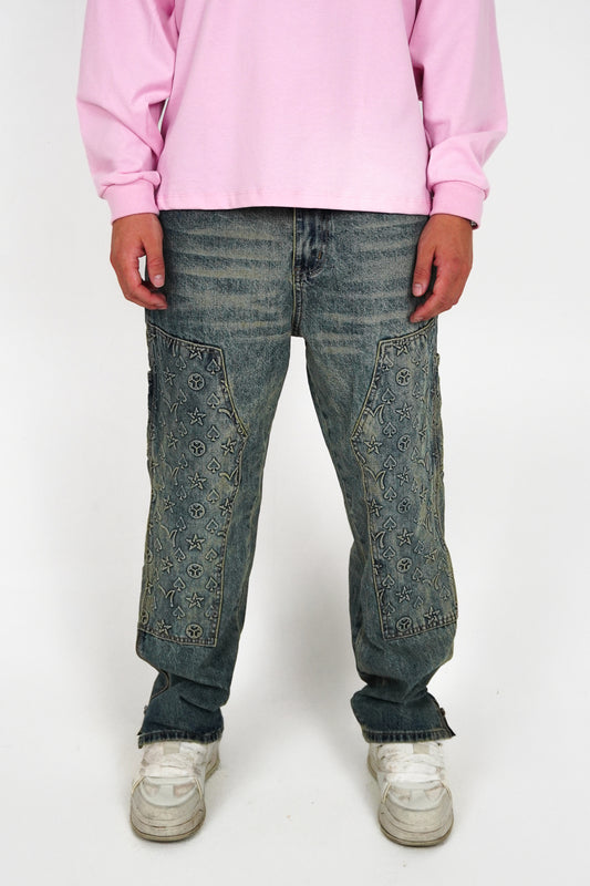 Person wearing a pink sweatshirt and blue jeans on a white background