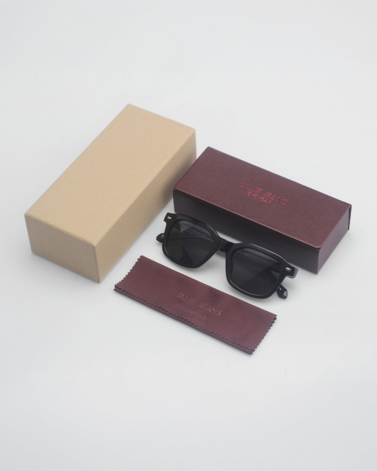 Billie Sunglasses Nova in black with the beige box, burgundy case and cleaning cloth