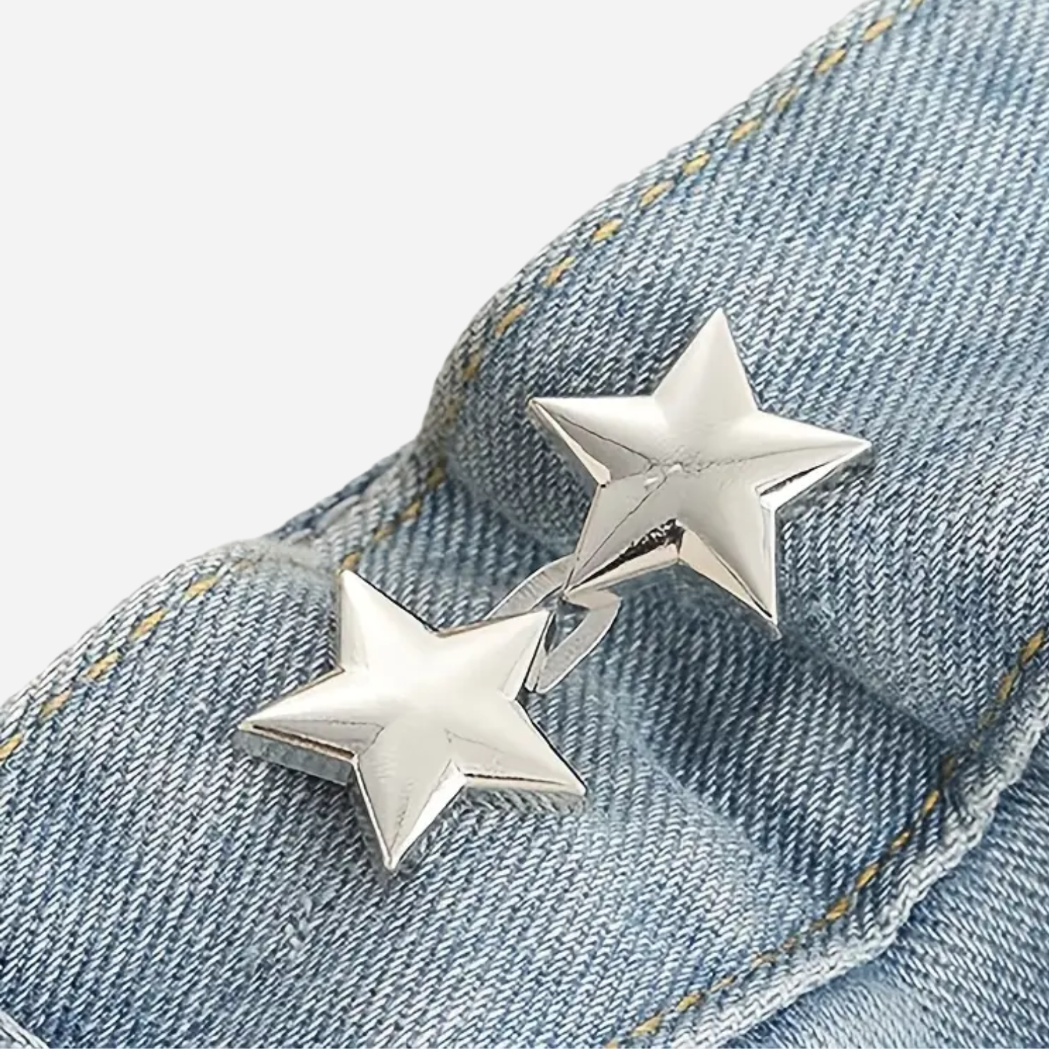 Silver star-shaped waist knotd on a denim background