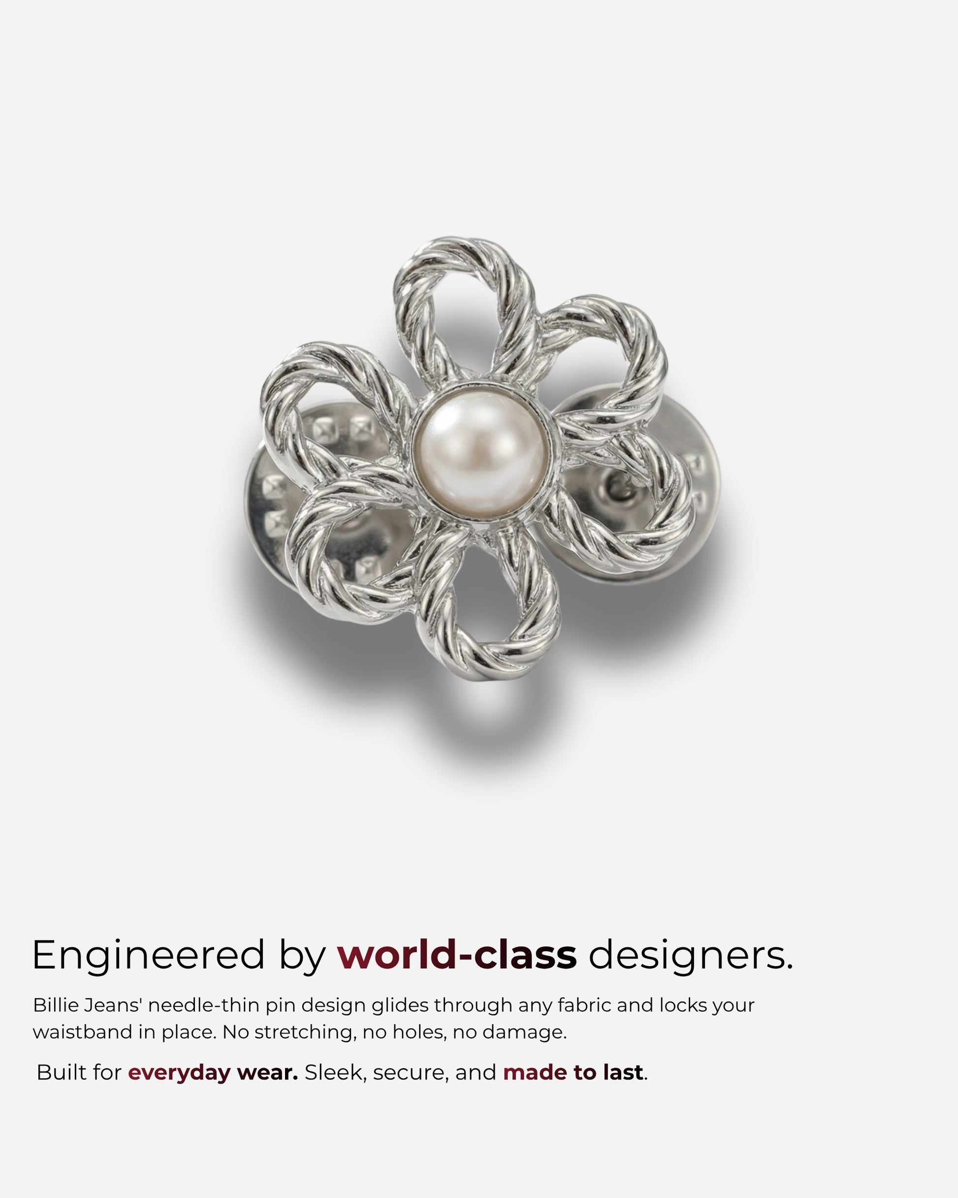 Silver flower-shaped pin with a pearl center on a plain background.