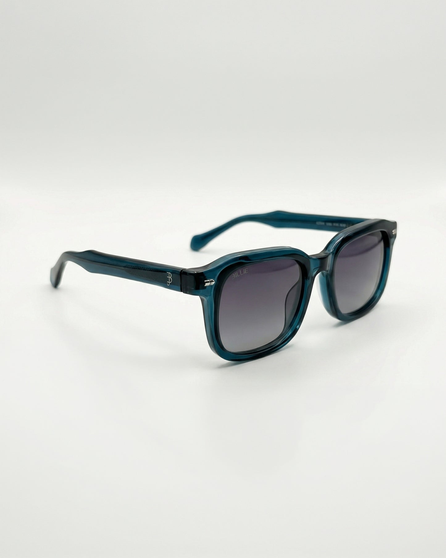 Teal sunglasses with gradient lenses on a plain background