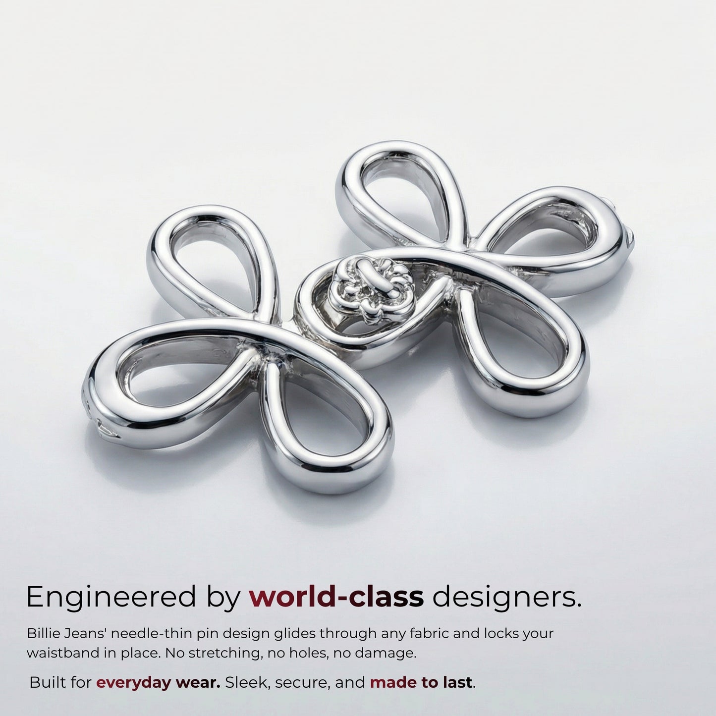 Billie Jeans chrome silver ornamental jeans pin with four looped petals and rosette center