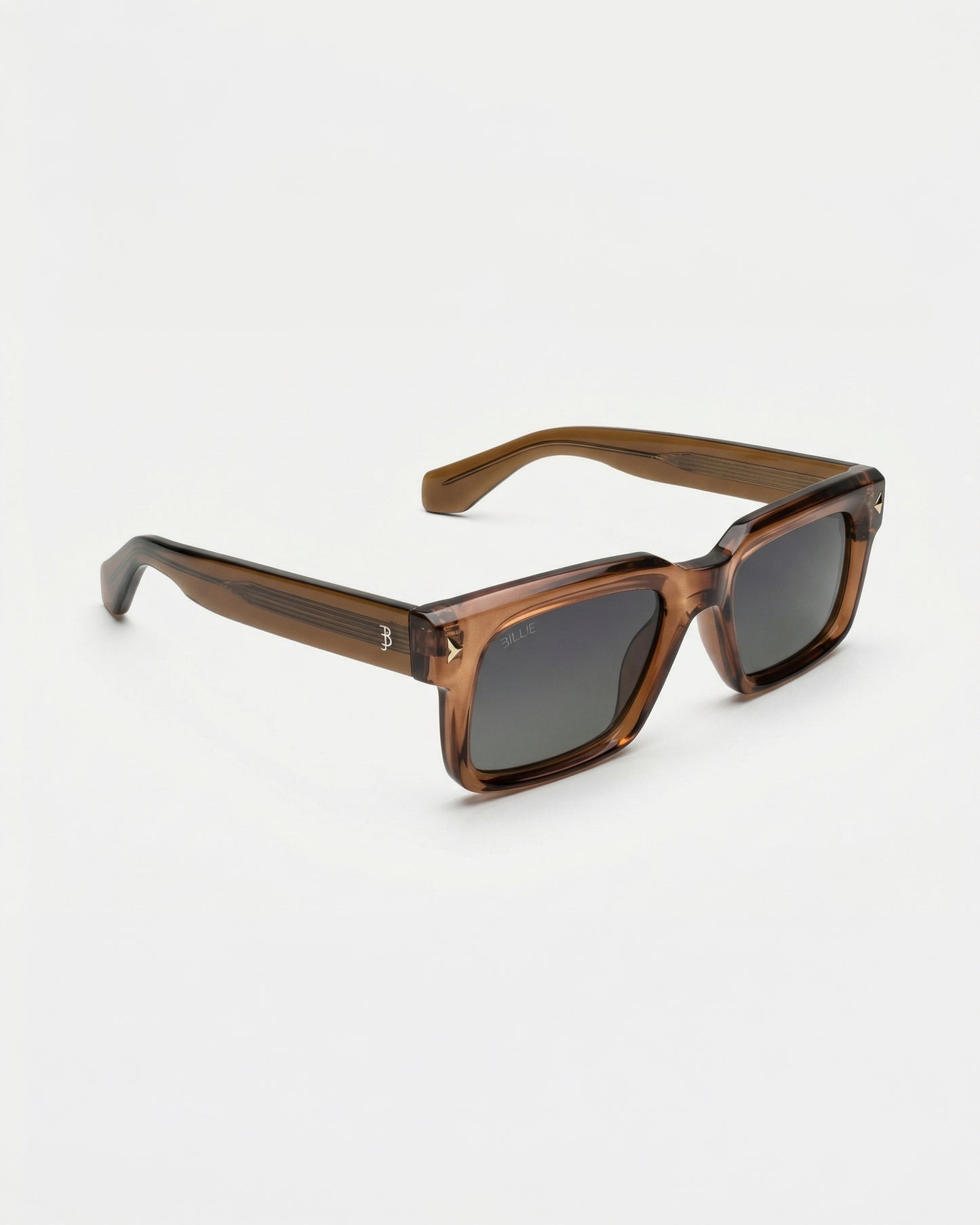 Brown sunglasses with dark lenses on a plain background