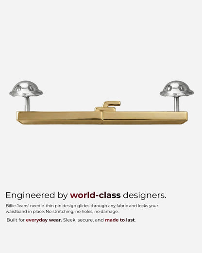 Gold and silver clasp with two rounded ends on a plain background.