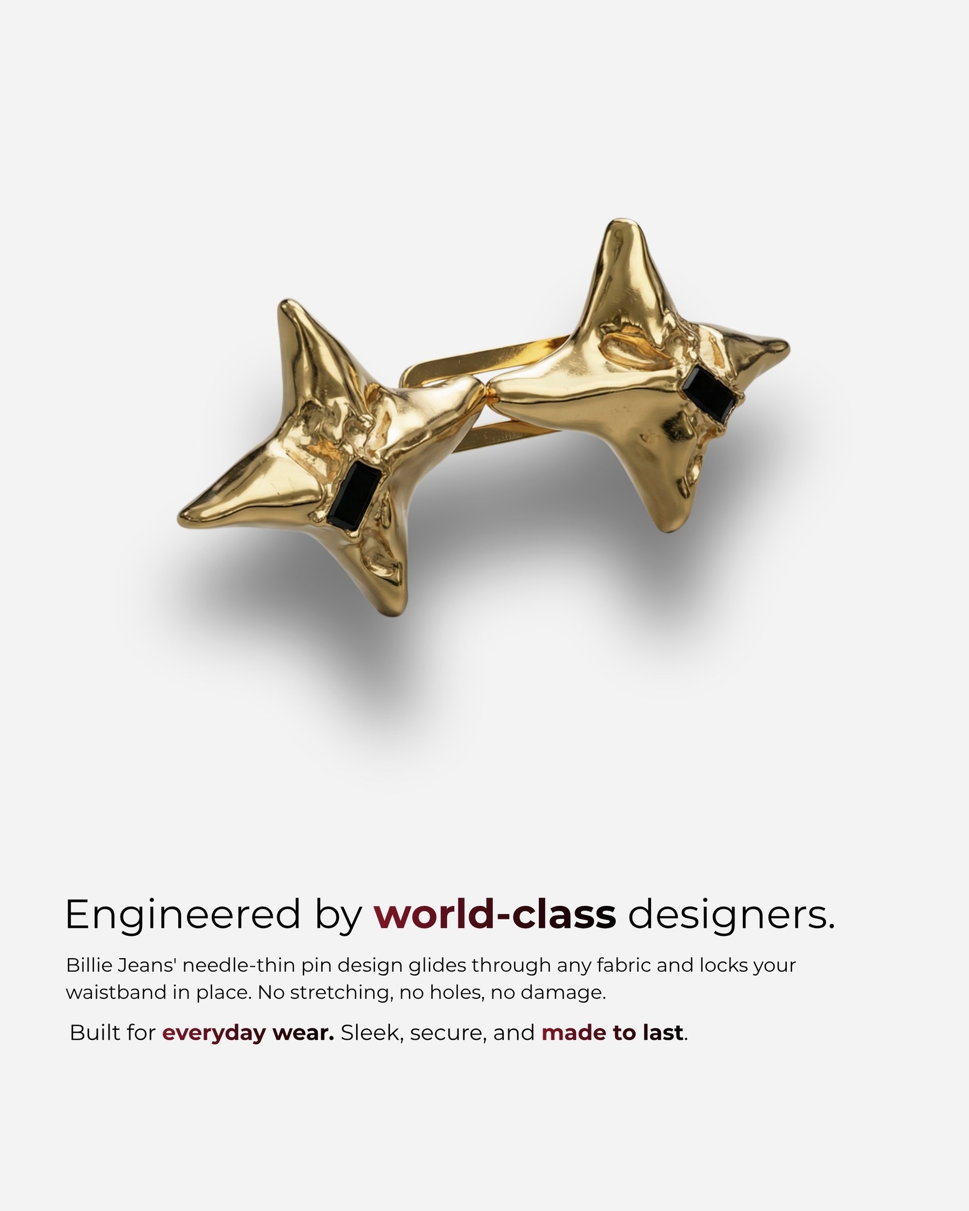 Gold star-shaped accessory with black accents on a plain background.