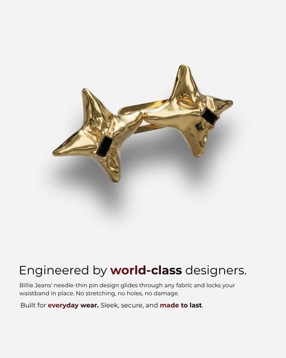 Gold star-shaped accessory with black accents on a plain background.