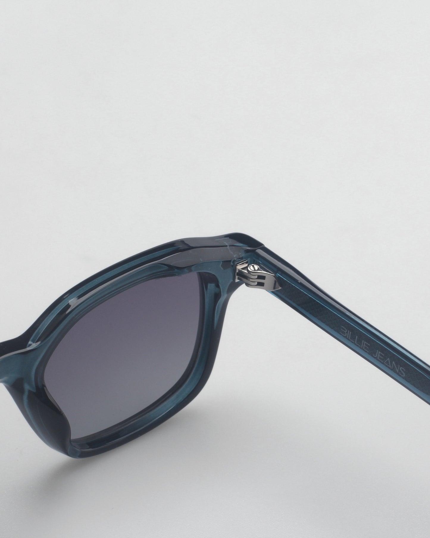 Blue sunglasses with gradient lenses on a plain background