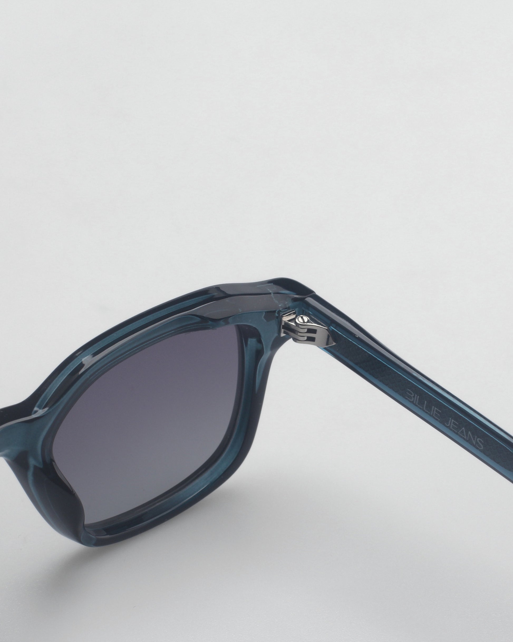 Blue sunglasses with gradient lenses on a plain background