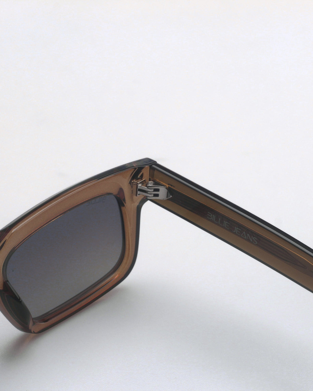 Close-up of the brown frame and hinge of the Billie Sunglasses Monarch