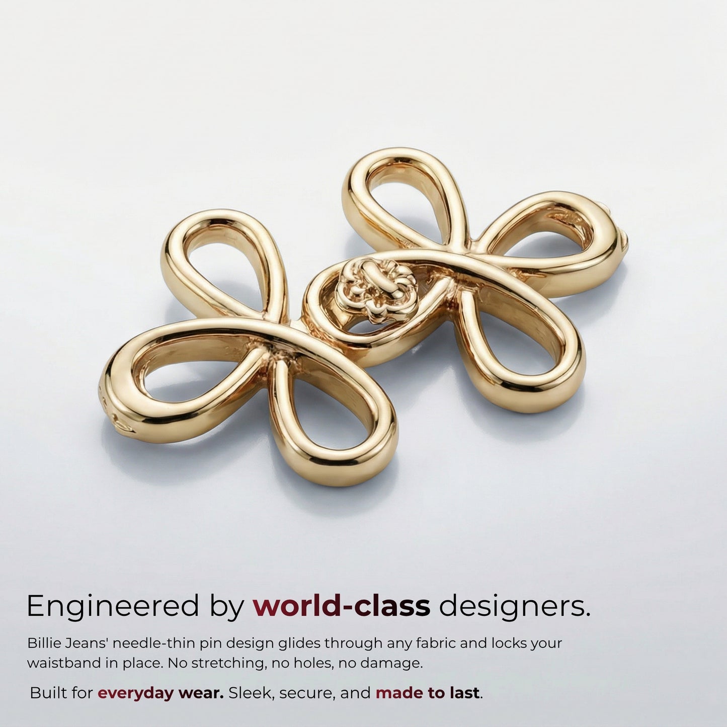 Billie Jeans polished gold ornamental jeans pin with four looped petals and rosette center