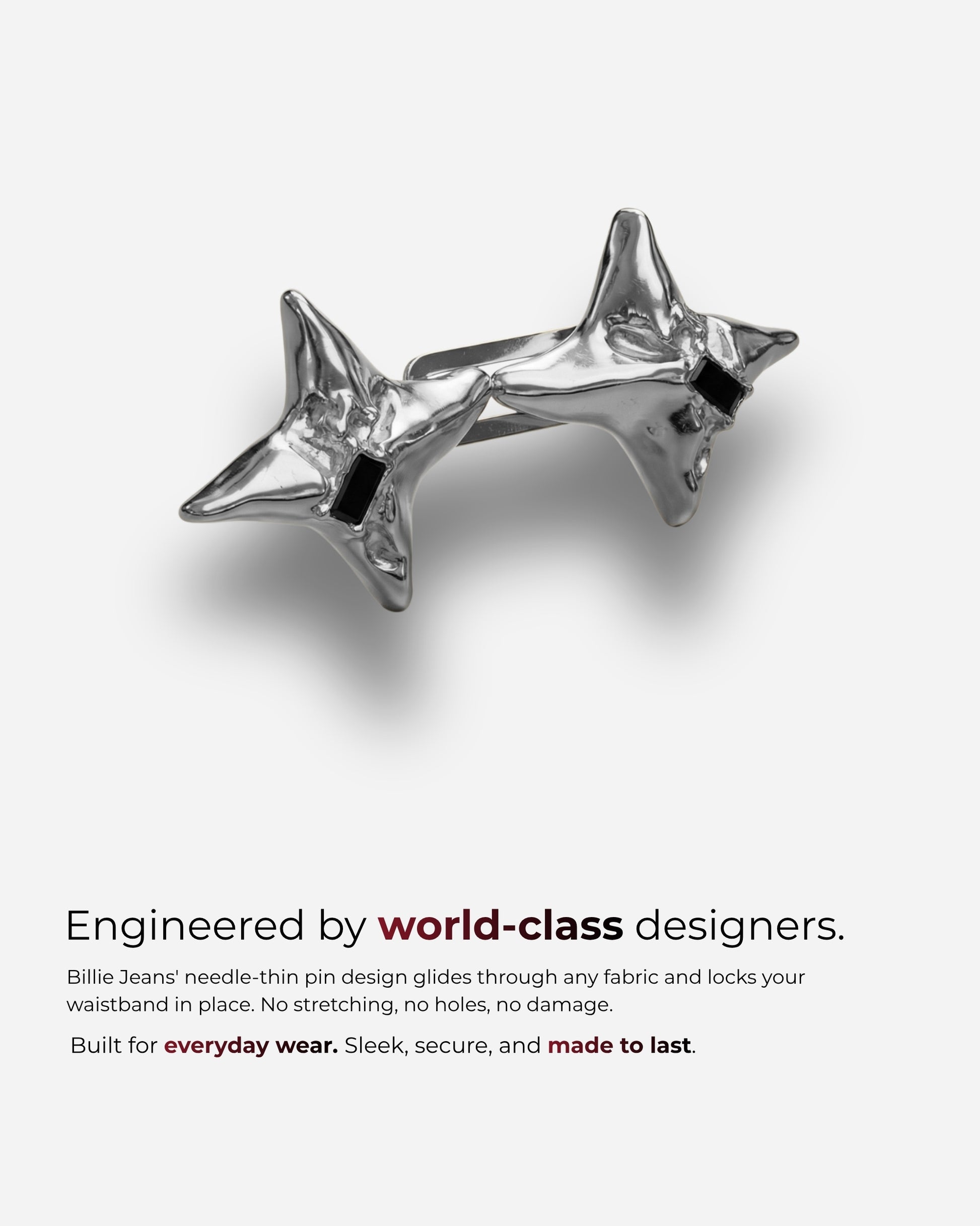 Two star-shaped metallic clips on a plain background.