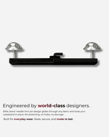 Black fastening device with two clear domes on a plain background.