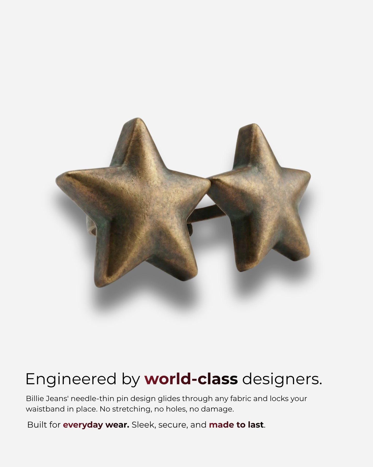 Two bronze star-shaped pins on a plain background.
