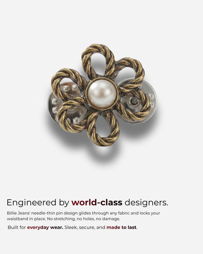 Flower-shaped pin with a pearl center and twisted metal design.