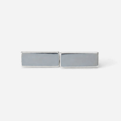 Rectangular silver cufflinks on a white background