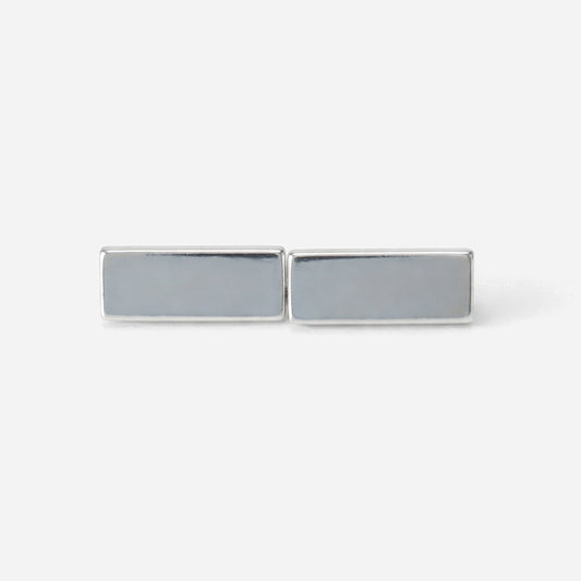 Rectangular silver cufflinks on a white background