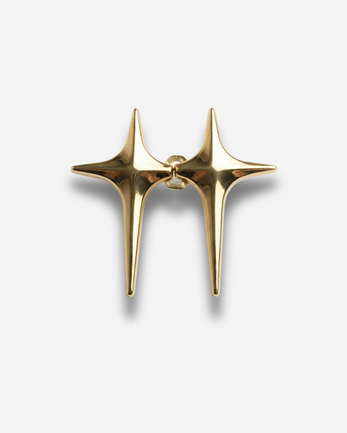 Billie Jeans Pins Stellar jeans pins in gold, two four-point starburst pins with butterfly clasps, front view on a light background