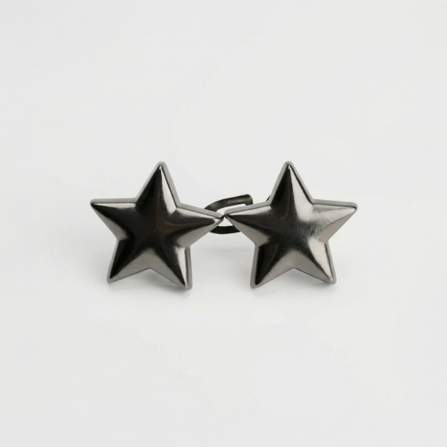 Star-shaped earrings on a light gray background