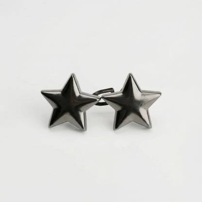 Star-shaped earrings on a light gray background