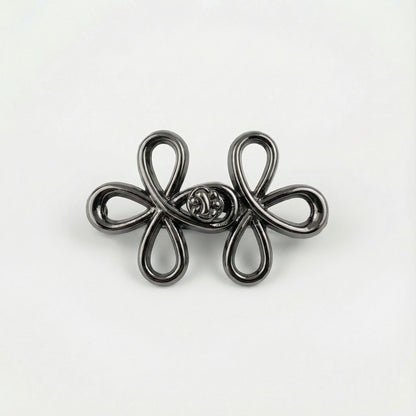 Silver floral brooch on a white background