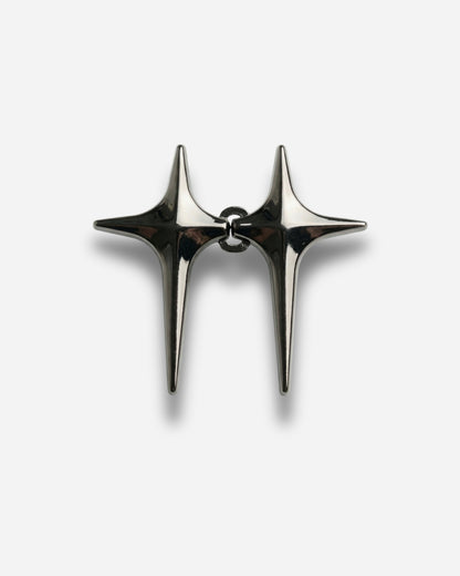 Two metallic star-shaped earrings connected by a small loop.