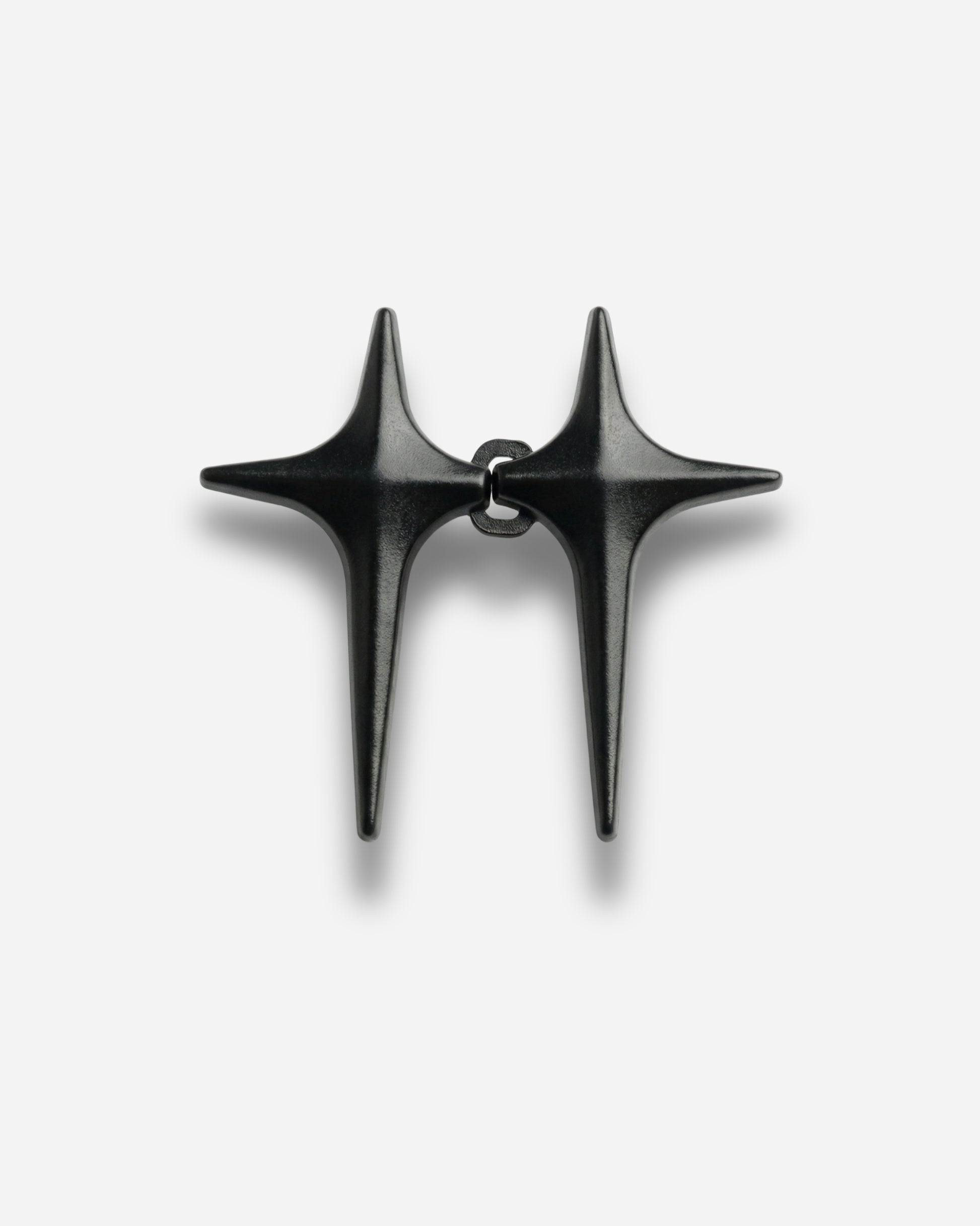 Black accessory with two pointed ends connected at the center