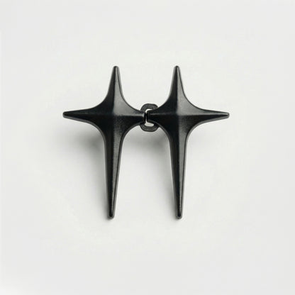 Black star-shaped earrings on a white background