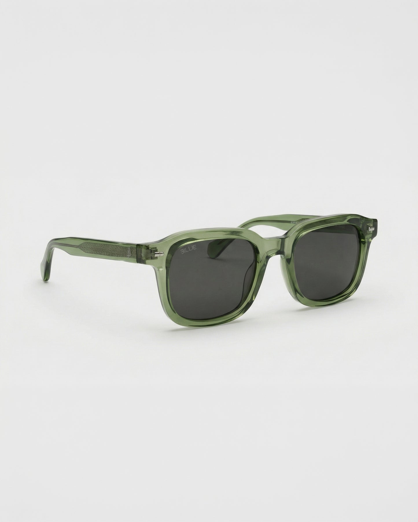 Green sunglasses with dark lenses on a plain background