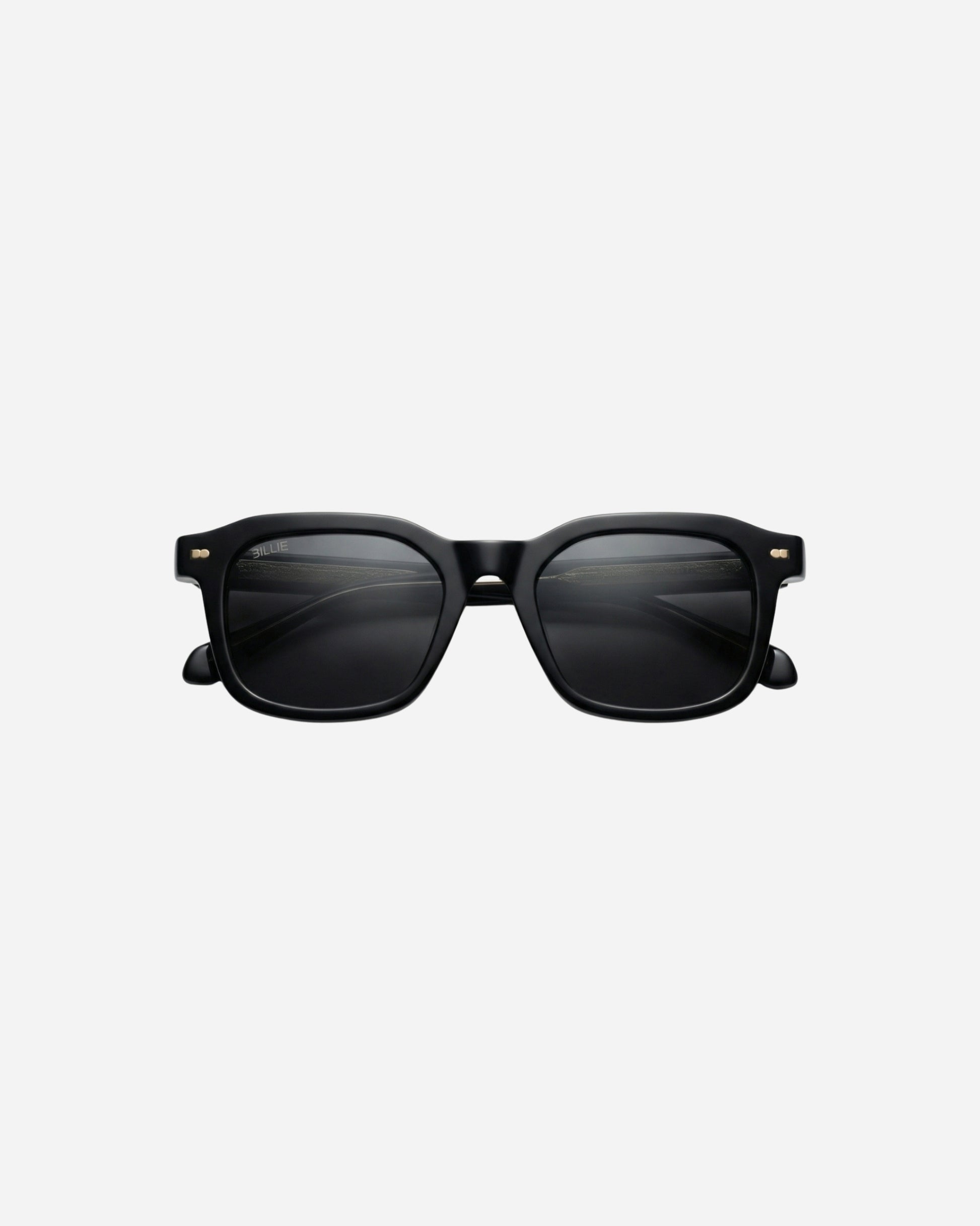 Black sunglasses with a square frame on a plain background