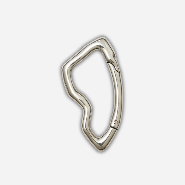 Silver carabiner on a light gray background