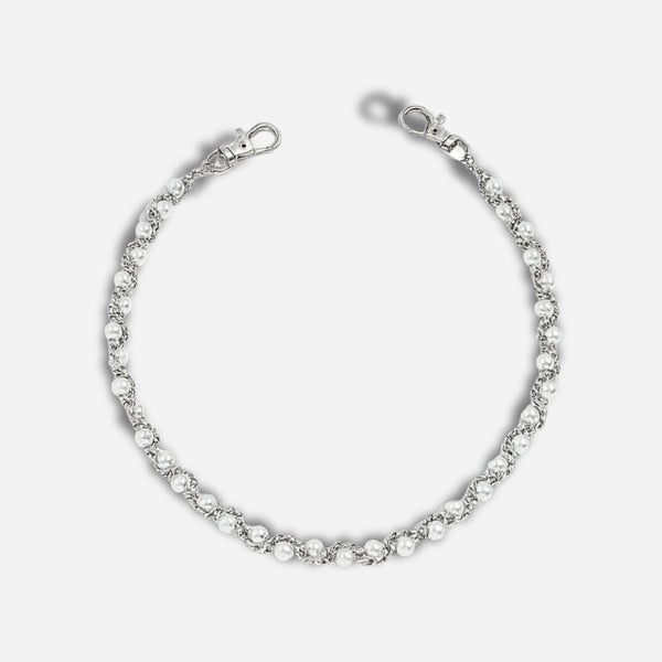 Silver bracelet with clear stones on a white background