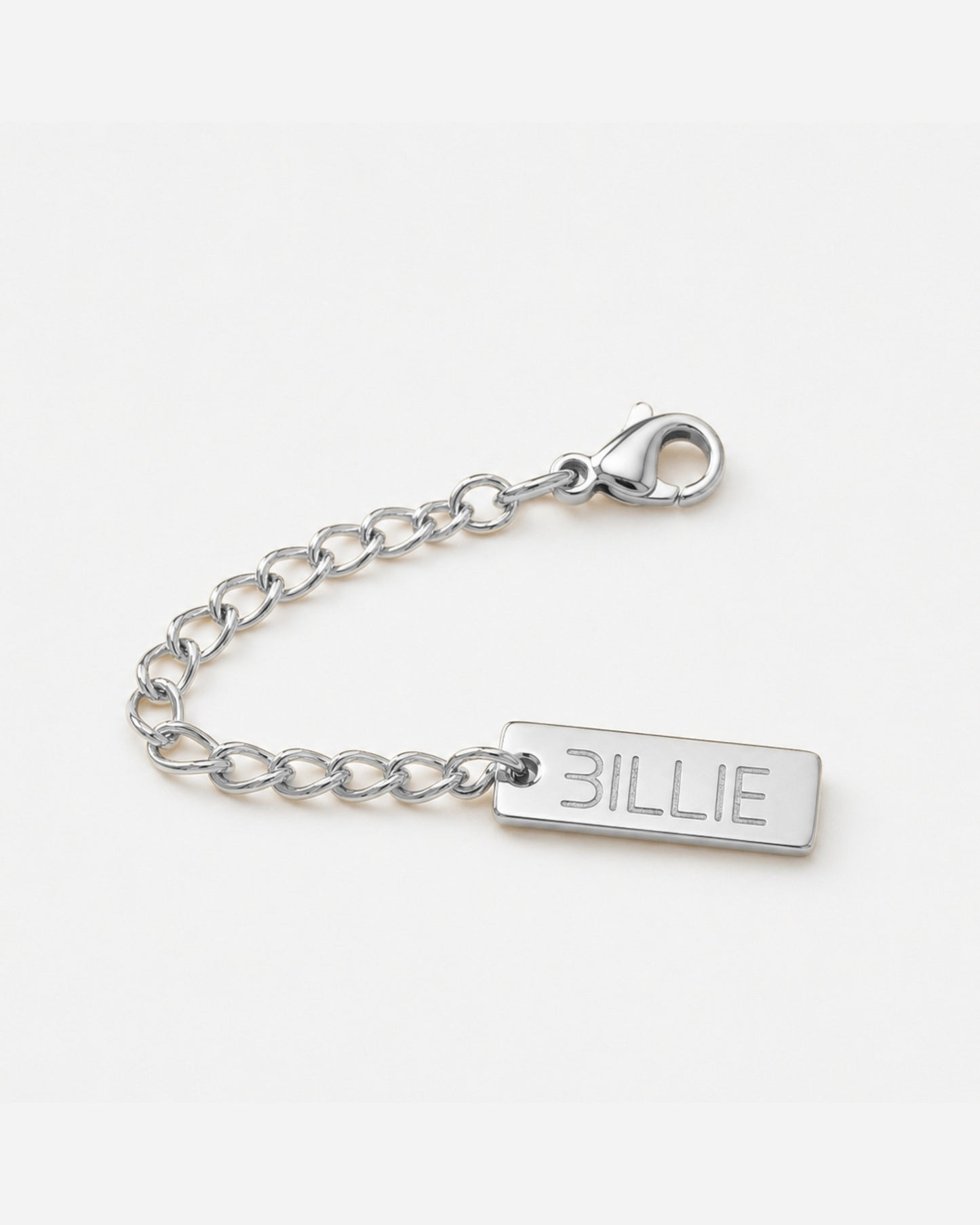 Silver chain with a rectangular tag engraved with the word 'BILLIE'.