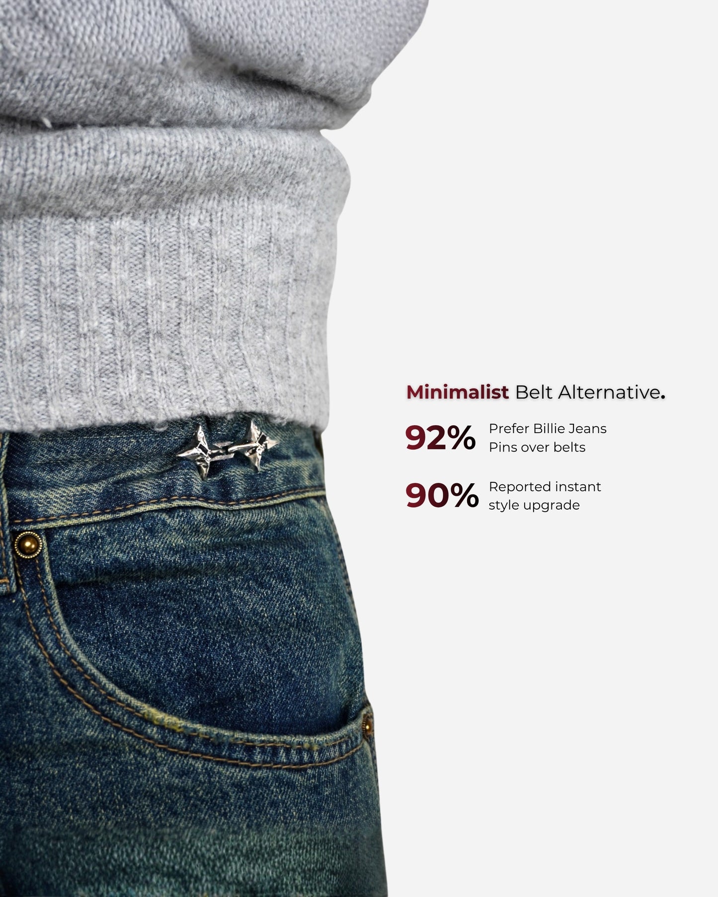 Close-up of a person wearing a gray sweater and blue jeans with decorative pins.