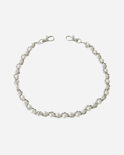 Silver chain with round white beads, displayed on a plain background.