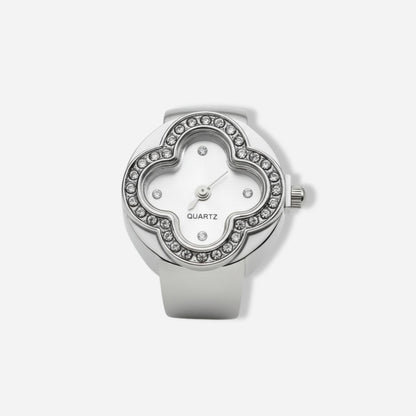 Silver ring watch with gemstone accents on a white background