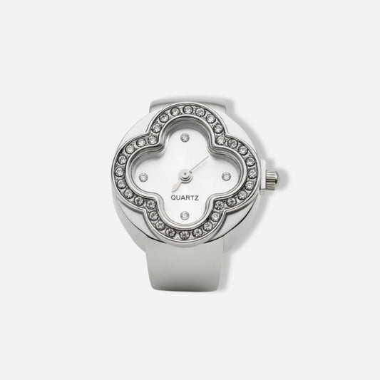 Silver ring watch with gemstone accents on a white background