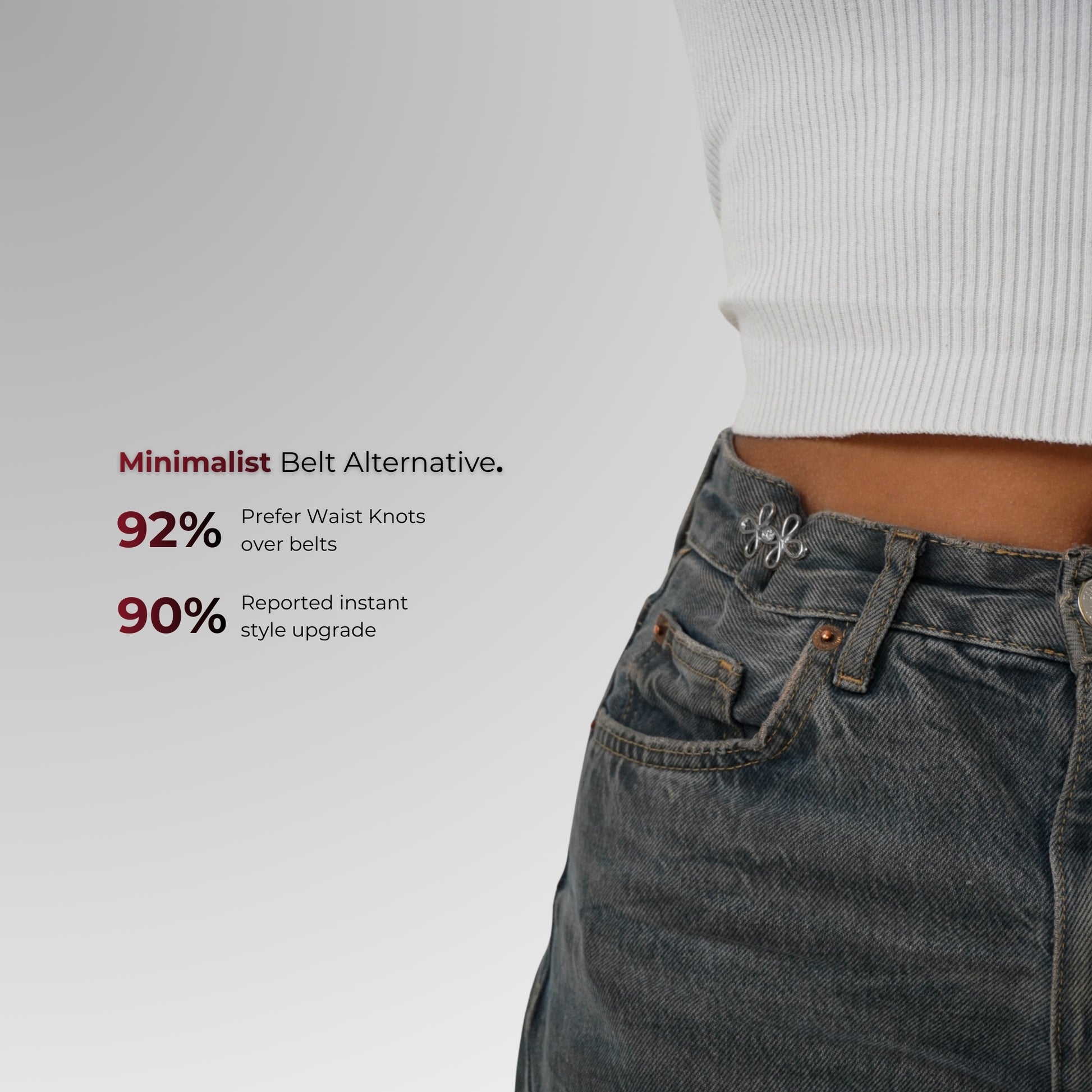 Person wearing jeans with waist knots on a plain background