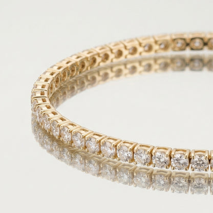 Gold tennis bracelet on mirror
