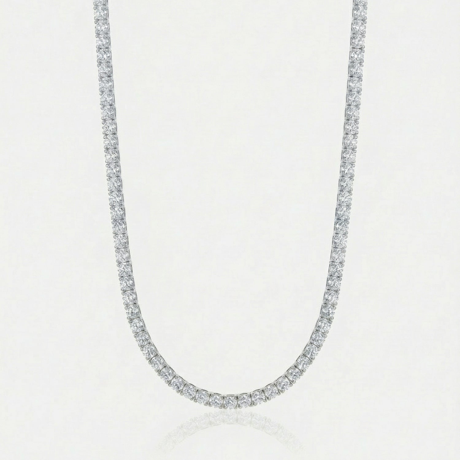 Diamond necklace on a light gray background