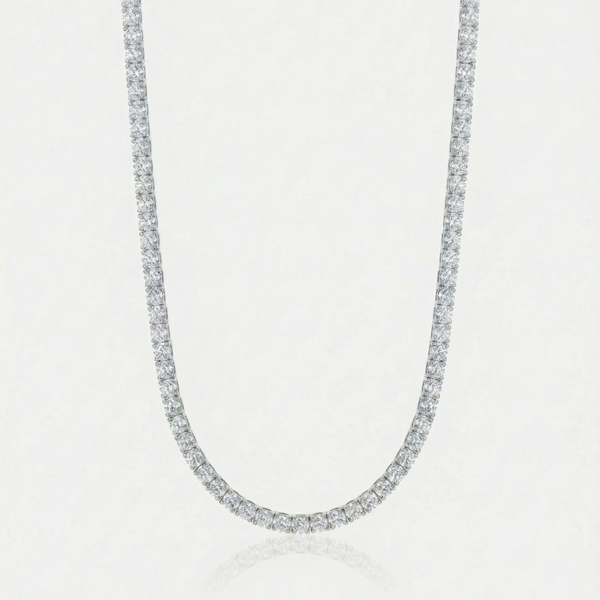 Diamond necklace on a light gray background