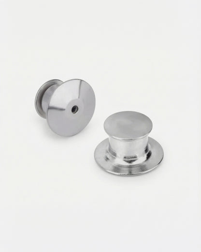 Two metallic buttons on a plain white background.